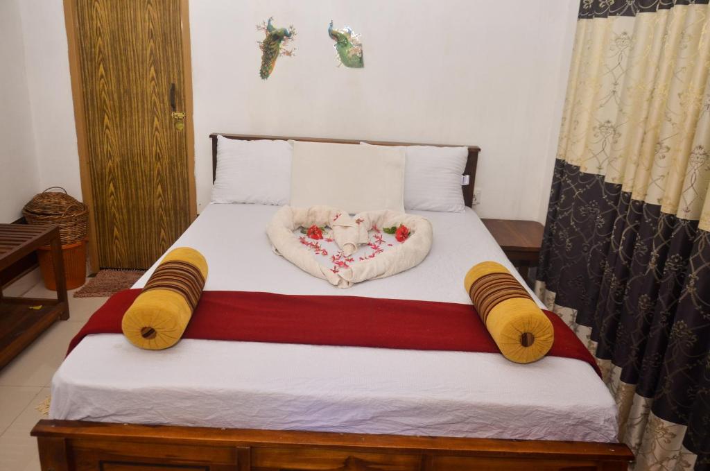 Postel nebo postele na pokoji v ubytování Triangle Home Stay