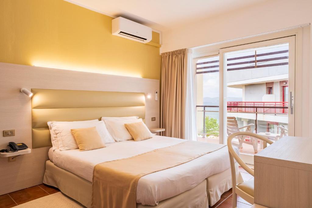 Postel nebo postele na pokoji v ubytování Hotel Florida