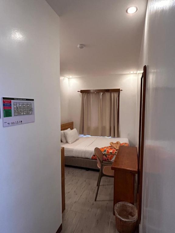 Voodi või voodid majutusasutuse Puyo Suites Homestay toas