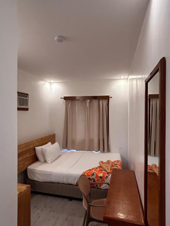 Voodi või voodid majutusasutuse Puyo Suites Homestay toas