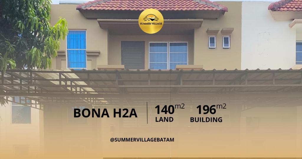 a house with a sign on the front of it at Bona H2A 5BR - Summer Veluxe in Batam Center