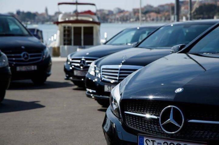 a row of parked cars parked in a parking lot at V class rental in Split
