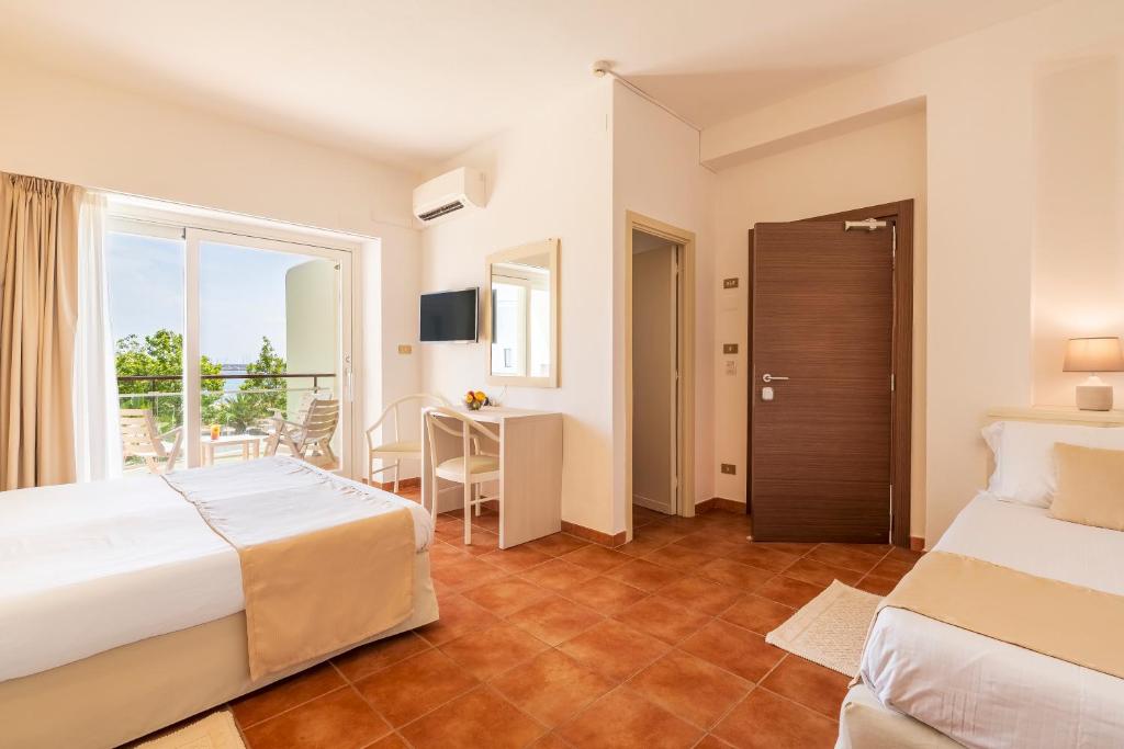 Postel nebo postele na pokoji v ubytování Hotel Florida