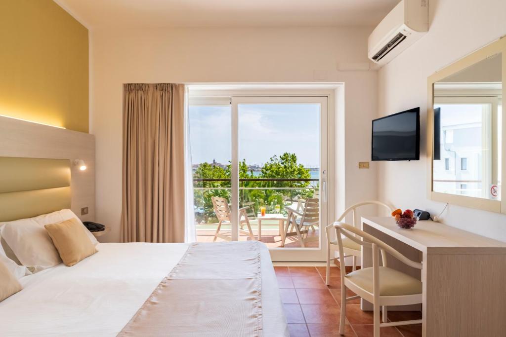 Postel nebo postele na pokoji v ubytování Hotel Florida