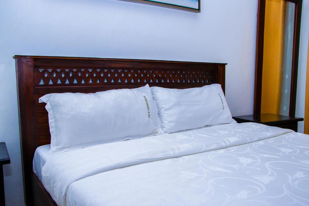 Postel nebo postele na pokoji v ubytování The Blixen Resort & Spa