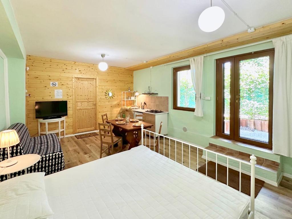 a bedroom with a bed and a living room at private spa in historic villa with pool in Senigallia in Senigallia