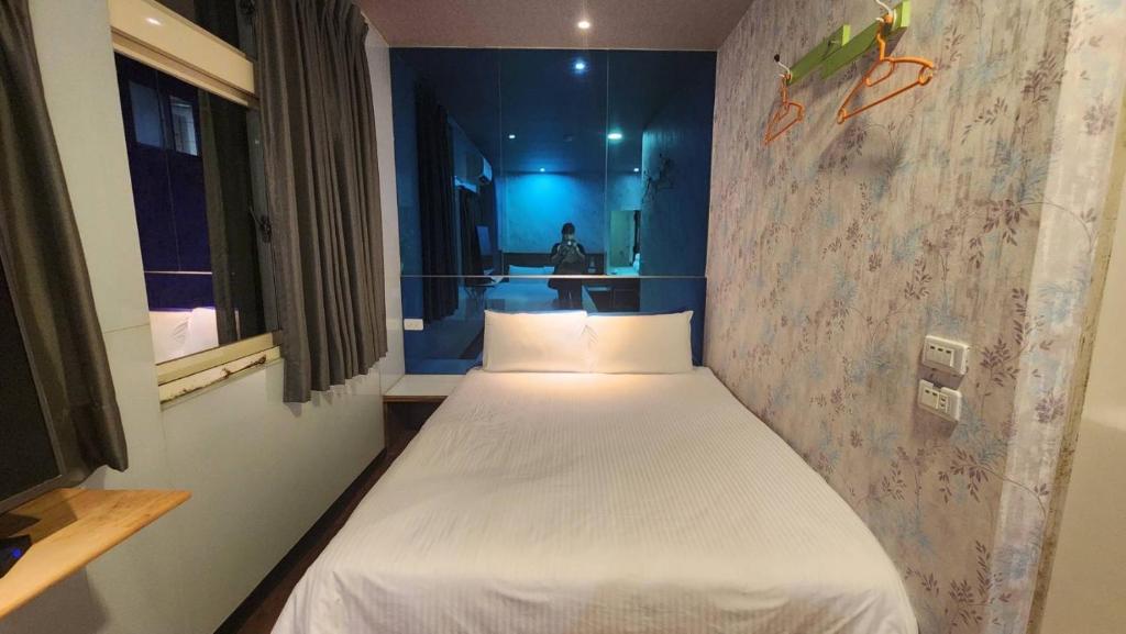 Postel nebo postele na pokoji v ubytování Yung Feng Hotel