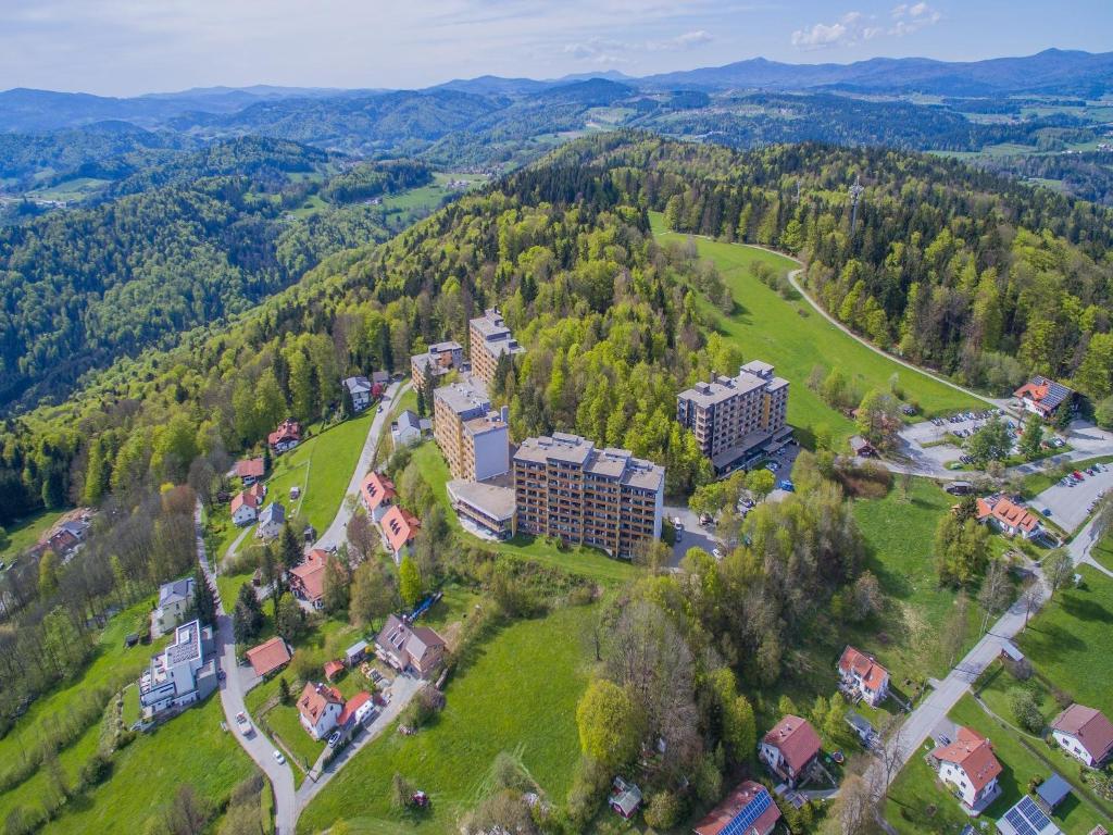 an aerial view of a building on a hill with trees at Appartement Serges mit Pool und Sauna in Freyung in Freyung