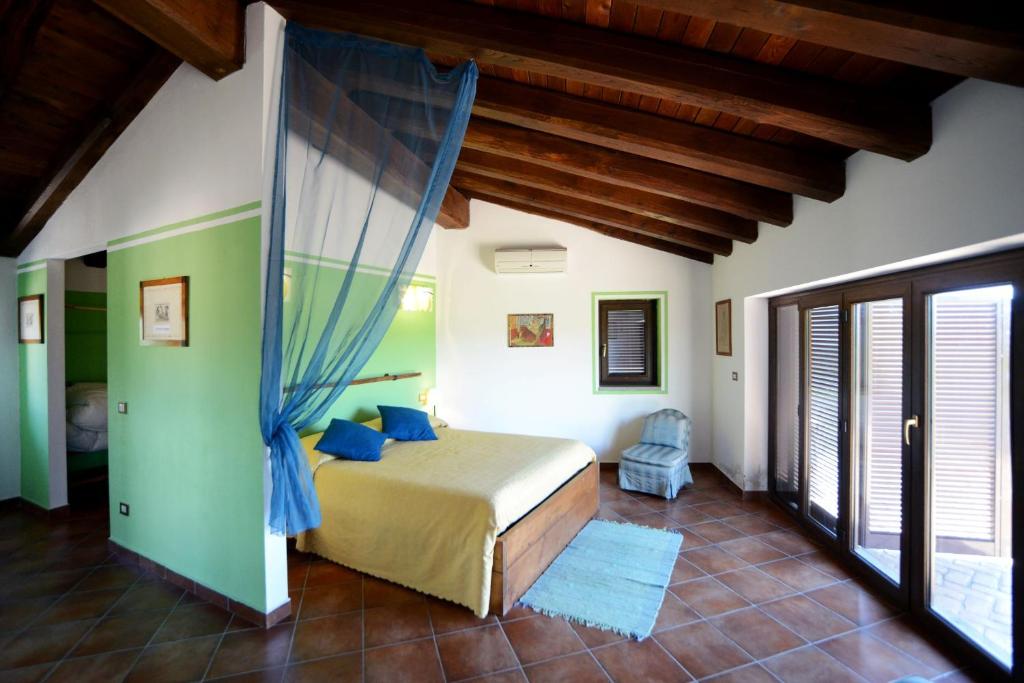 Posteľ alebo postele v izbe v ubytovaní Agriturismo Tenuta Monte La Guardia