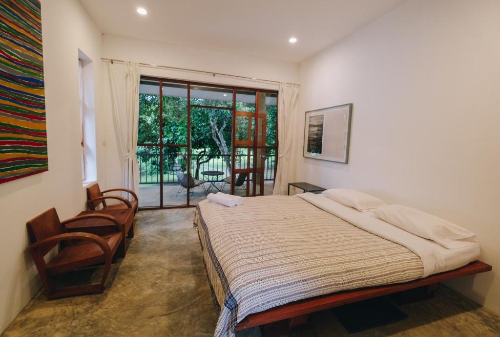Postel nebo postele na pokoji v ubytování Loogmai Guesthouse Chiang Khan - เรือนแรมลูกไม้ เชียงคาน