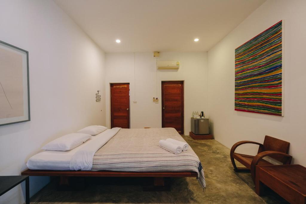 Postel nebo postele na pokoji v ubytování Loogmai Guesthouse Chiang Khan - เรือนแรมลูกไม้ เชียงคาน