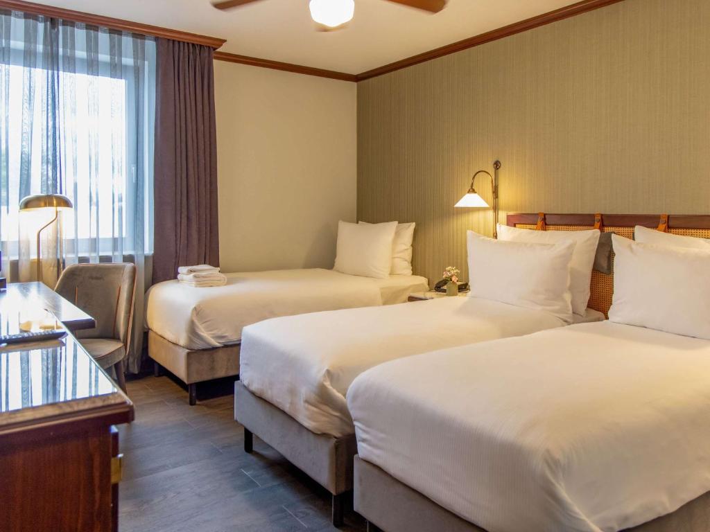 Postel nebo postele na pokoji v ubytování Mercure Hotel Frankfurt Airport Langen