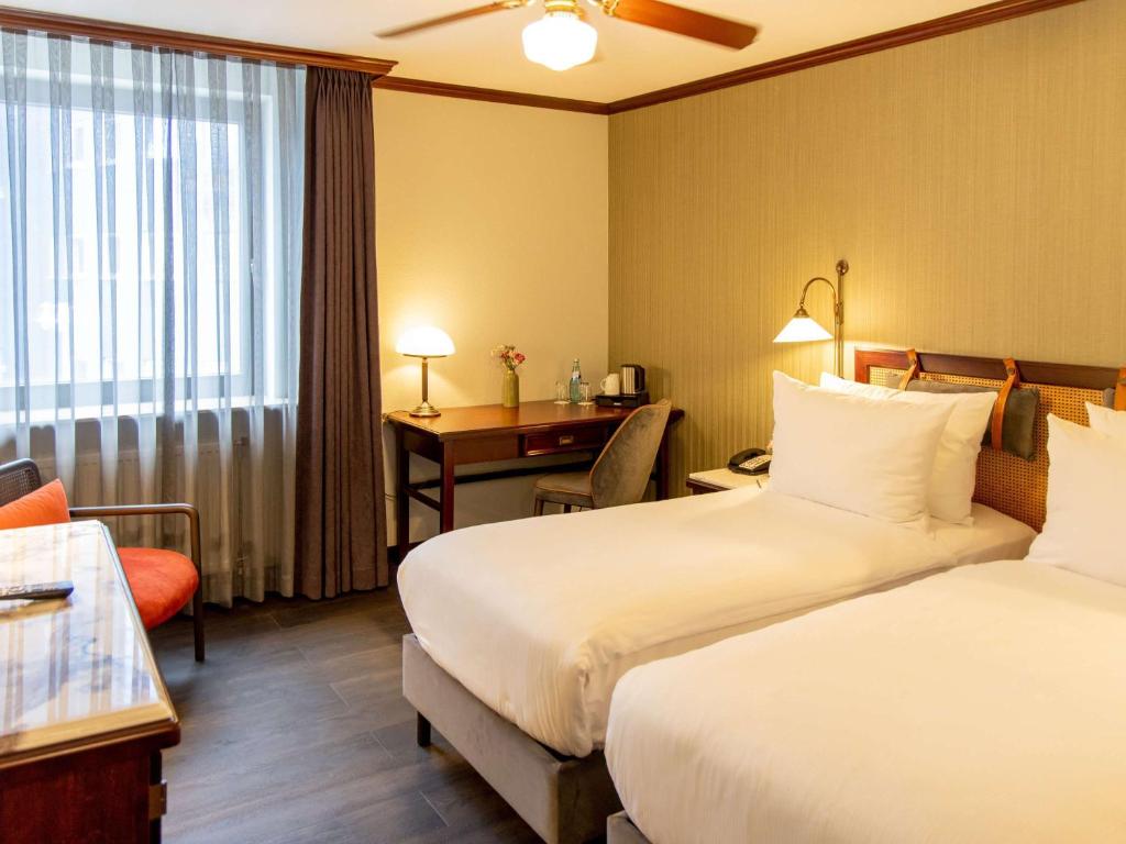 Postel nebo postele na pokoji v ubytování Mercure Hotel Frankfurt Airport Langen