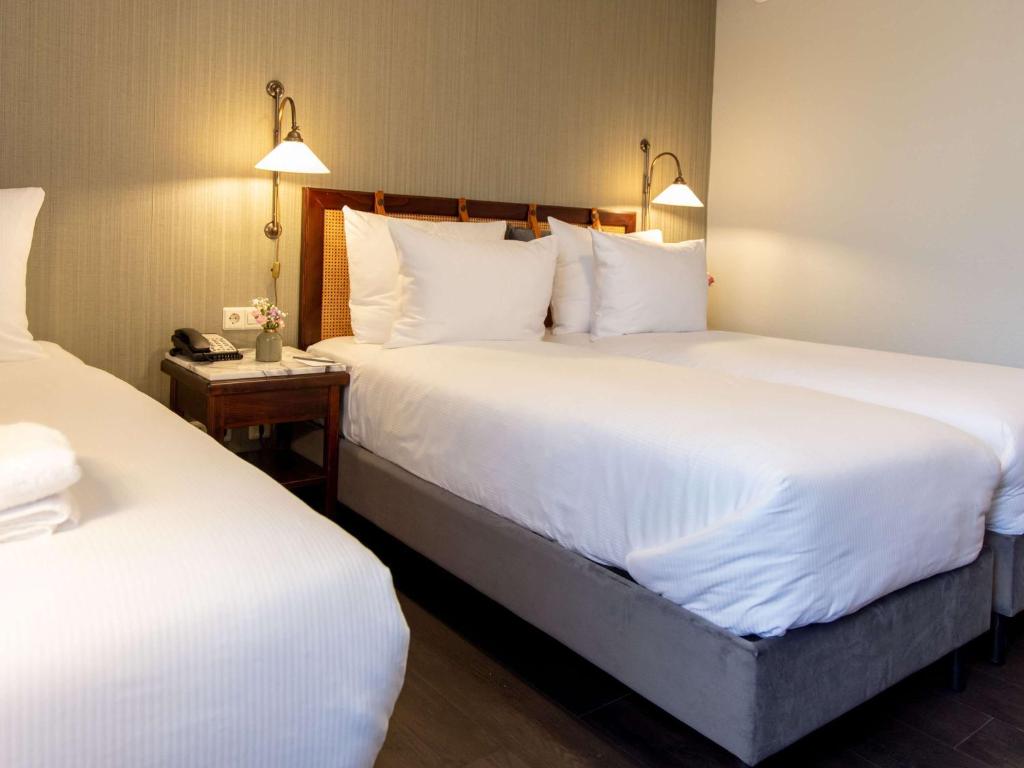 Postel nebo postele na pokoji v ubytování Mercure Hotel Frankfurt Airport Langen