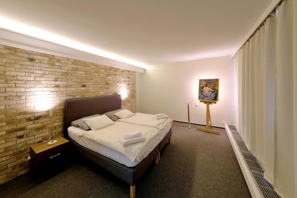 Katil atau katil-katil dalam bilik di ViDa Prostorný 220 m2 3BR Apartmán s Krbem a Zahradou, Ideální pro Rodiny