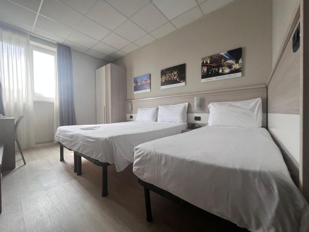 Postel nebo postele na pokoji v ubytování Best Quality Hotel La Darsena