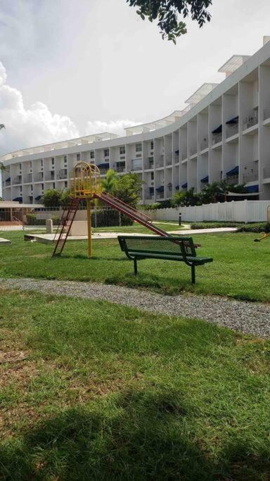 a playground in front of a large building at Ubicación genial a 3 minutos de combate Beach in El Combate