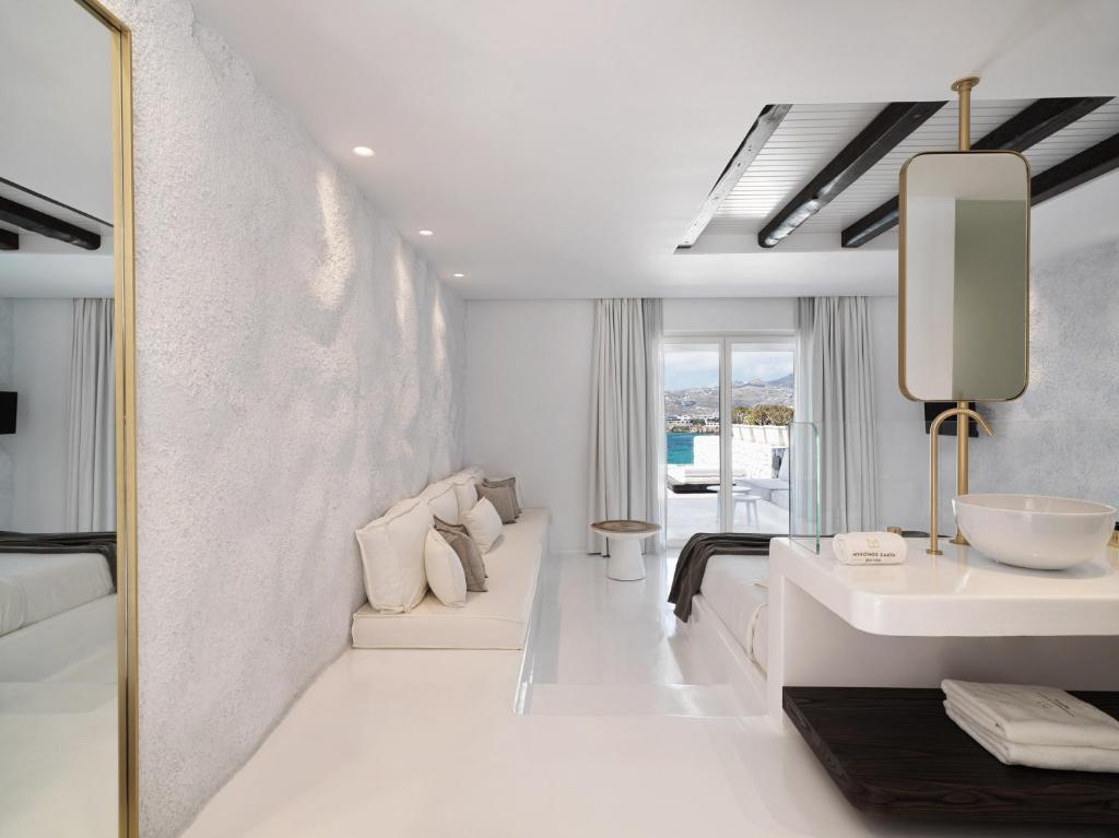 A bed or beds in a room at Mykonos Earth Suites