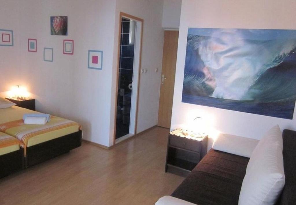 Łóżko lub łóżka w pokoju w obiekcie Apartments and Room Dar