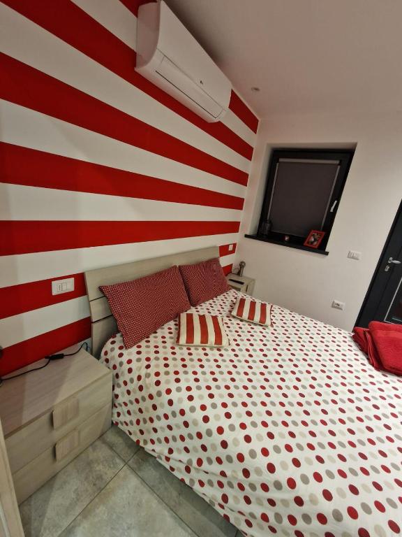 Postel nebo postele na pokoji v ubytování Casa Rosso Blu