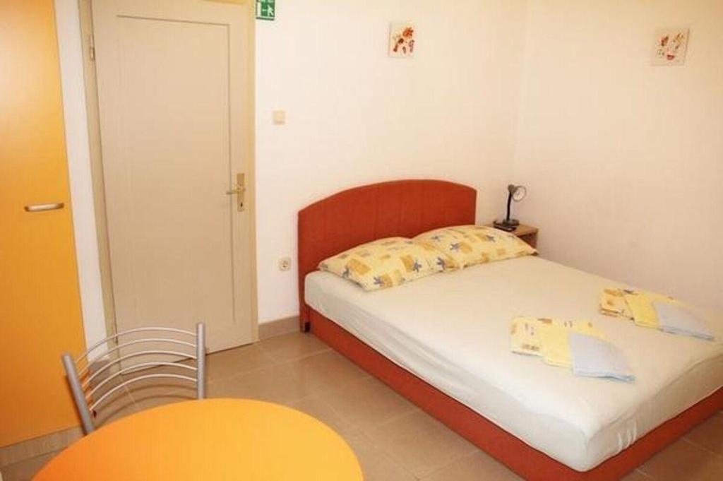 Posteľ alebo postele v izbe v ubytovaní Apartments Sini