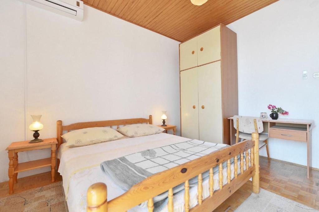 Posteľ alebo postele v izbe v ubytovaní Apartments Goran