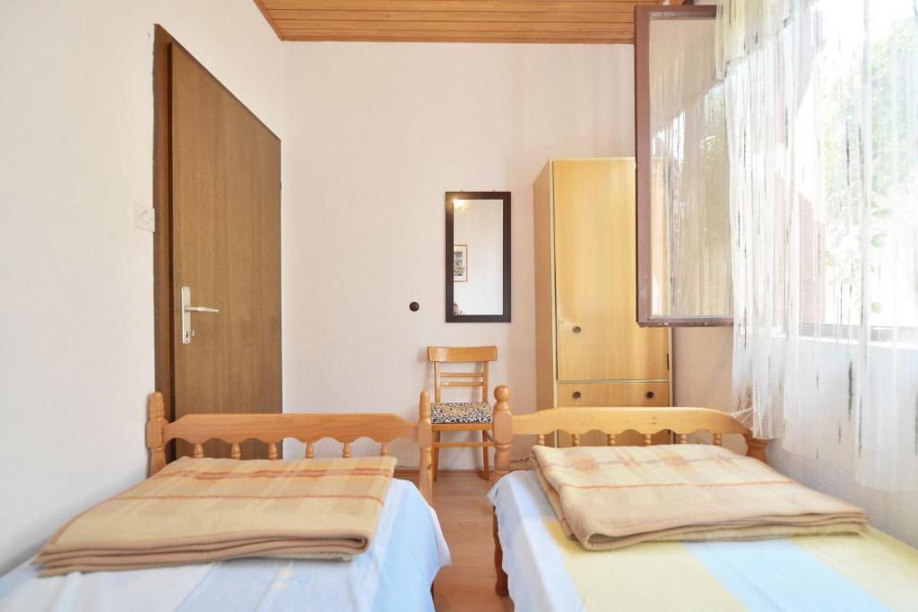 Posteľ alebo postele v izbe v ubytovaní Apartments Goran