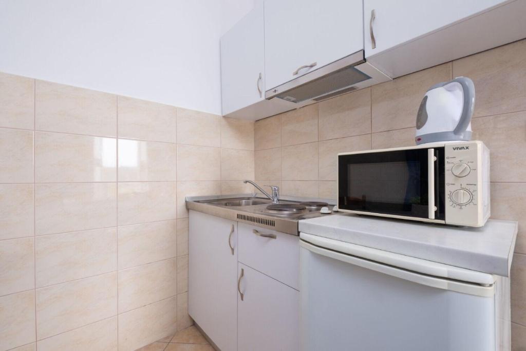 Kuchyňa alebo kuchynka v ubytovaní Apartments Mat