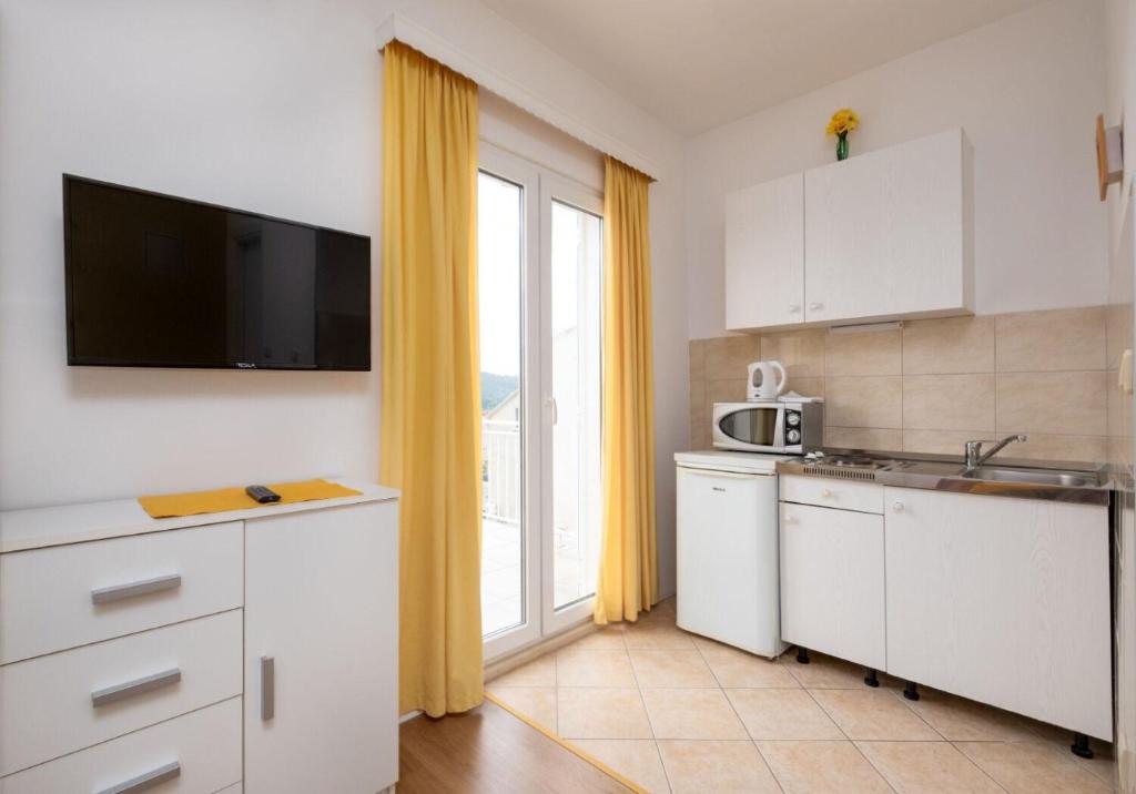 Kuchyňa alebo kuchynka v ubytovaní Apartments Mat
