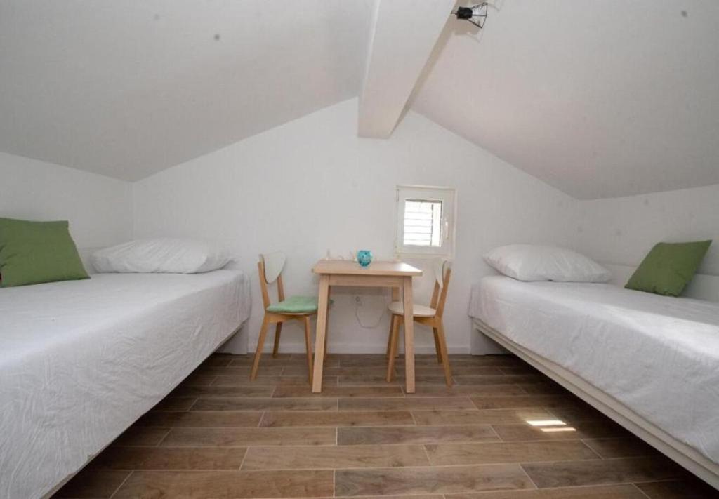 Postel nebo postele na pokoji v ubytování Apartments Mir