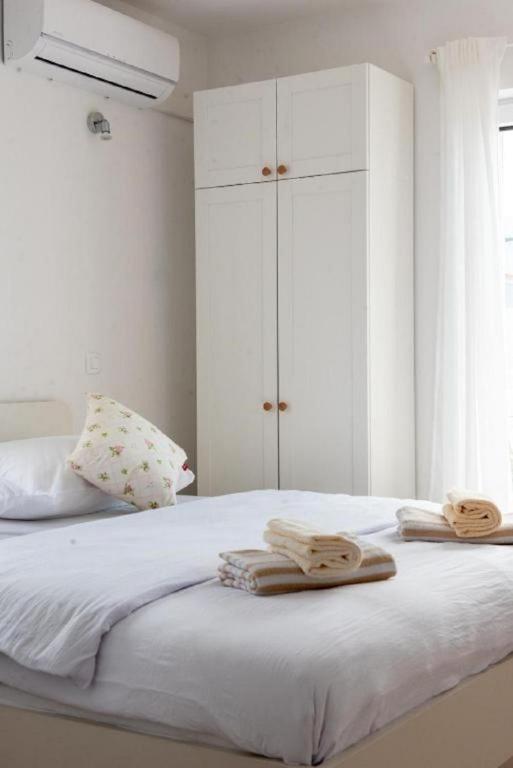 Postel nebo postele na pokoji v ubytování Apartments Mir