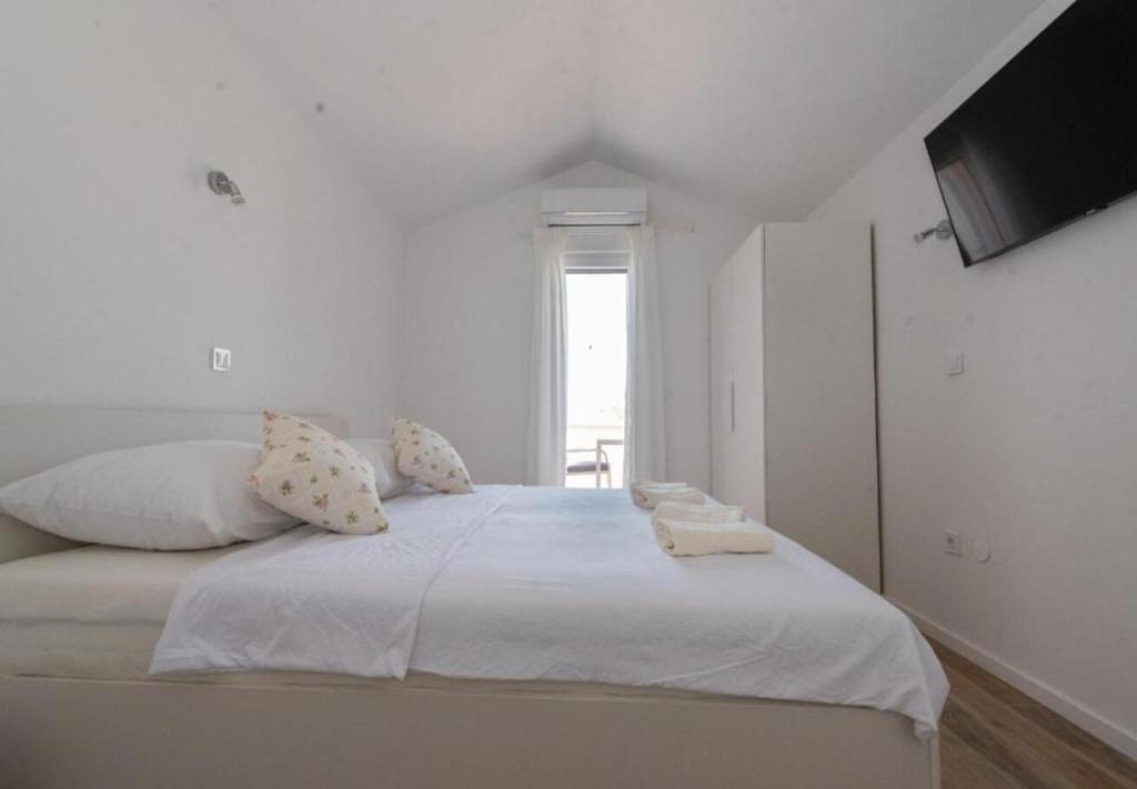 Postel nebo postele na pokoji v ubytování Apartments Mir