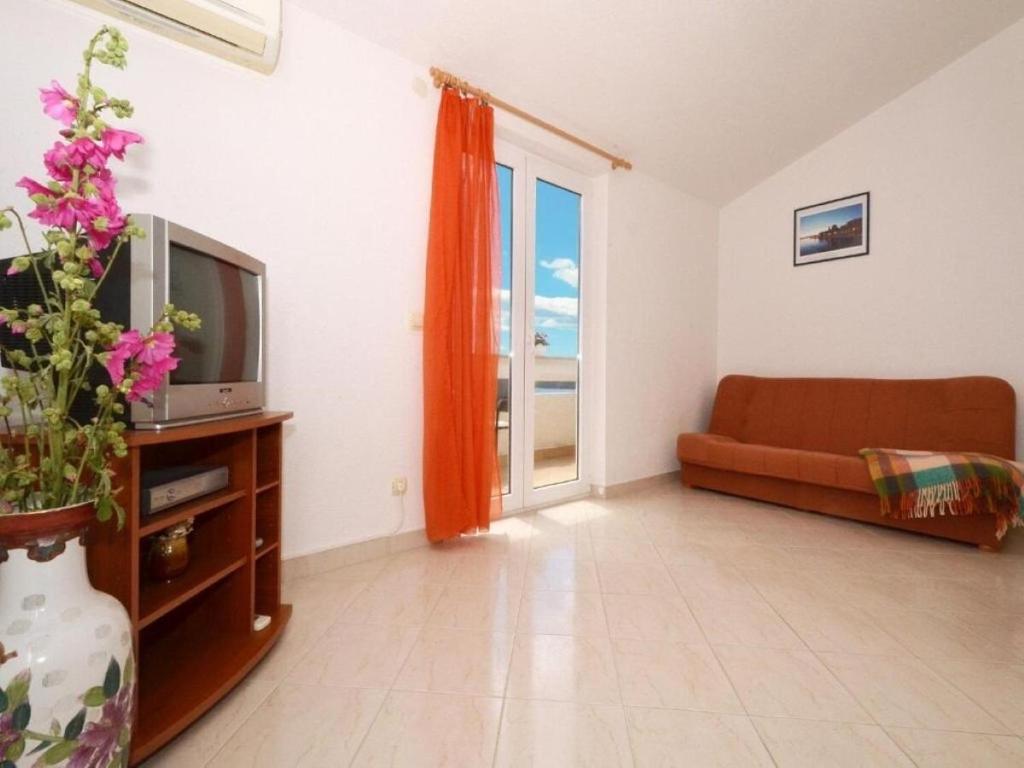 Televízia a/alebo spoločenská miestnosť v ubytovaní Apartments Zar