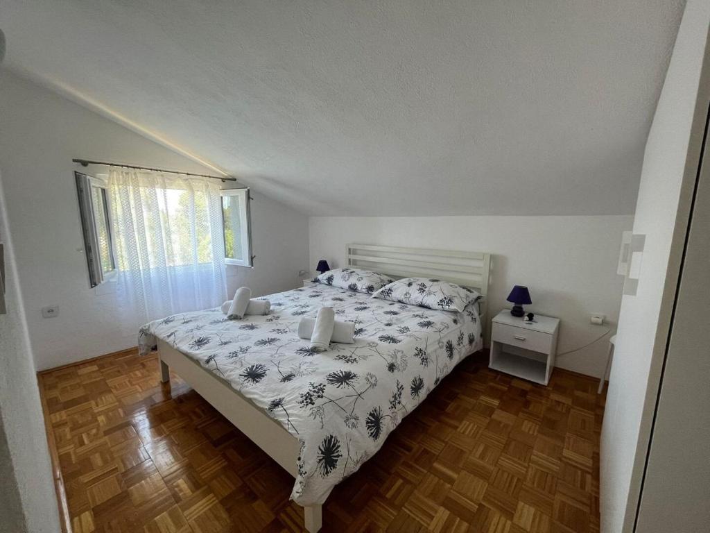Łóżko lub łóżka w pokoju w obiekcie Apartment Zeljko