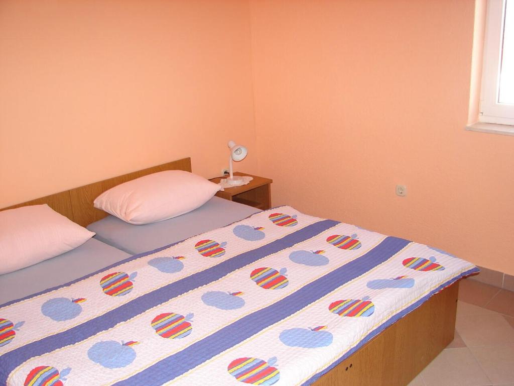 Postel nebo postele na pokoji v ubytování Apartments Mara