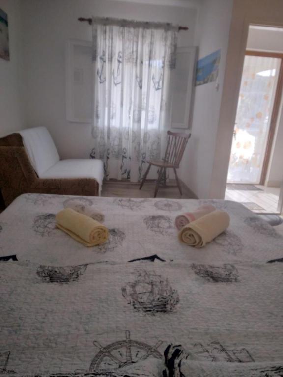 Postel nebo postele na pokoji v ubytování Apartments Roki