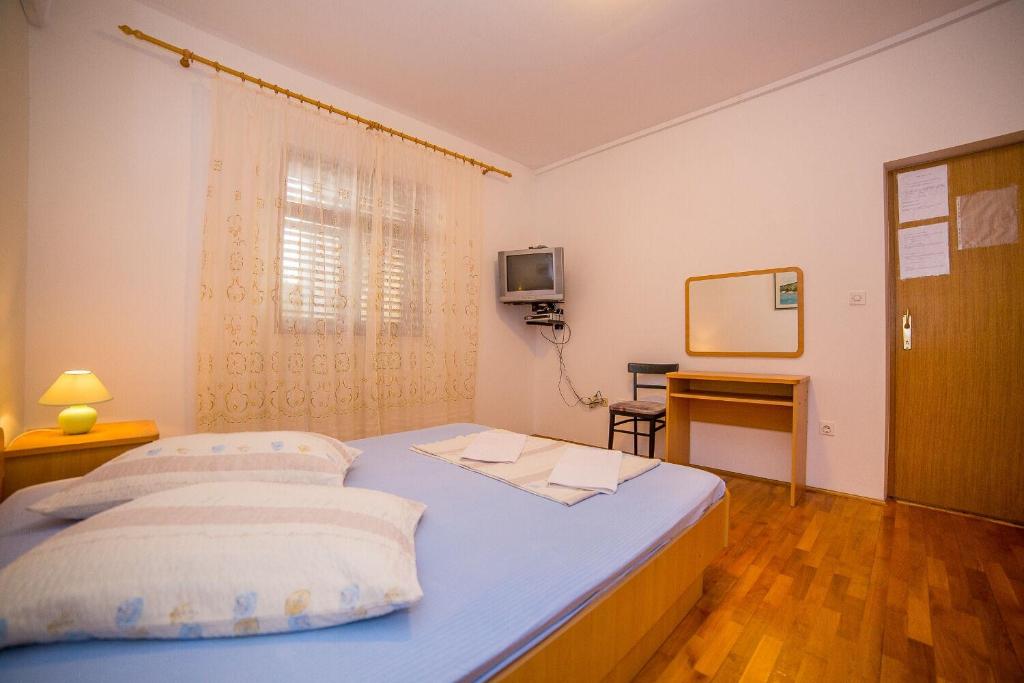 Posteľ alebo postele v izbe v ubytovaní Apartments Saga