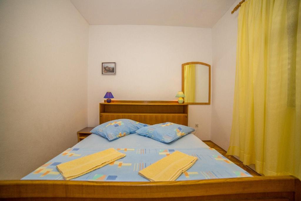 Posteľ alebo postele v izbe v ubytovaní Apartments Saga