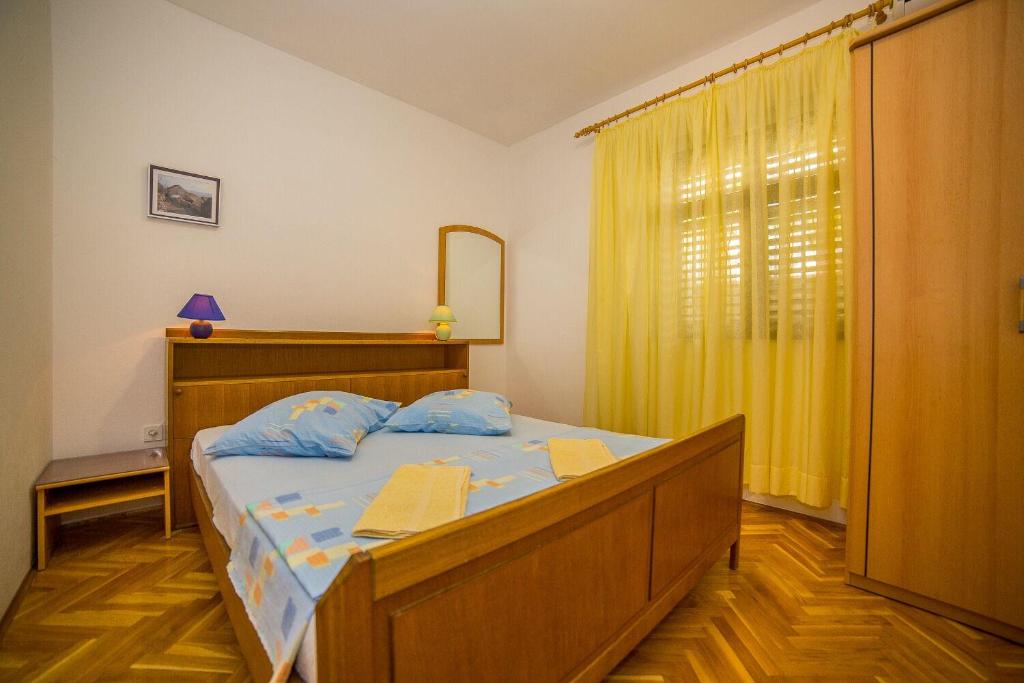 Posteľ alebo postele v izbe v ubytovaní Apartments Saga