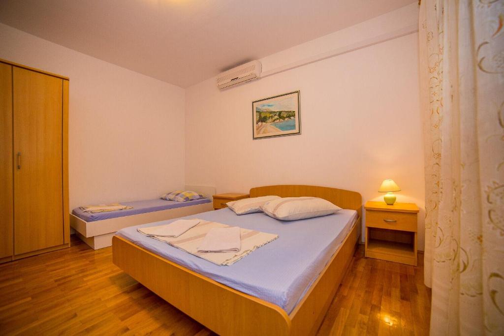 Posteľ alebo postele v izbe v ubytovaní Apartments Saga