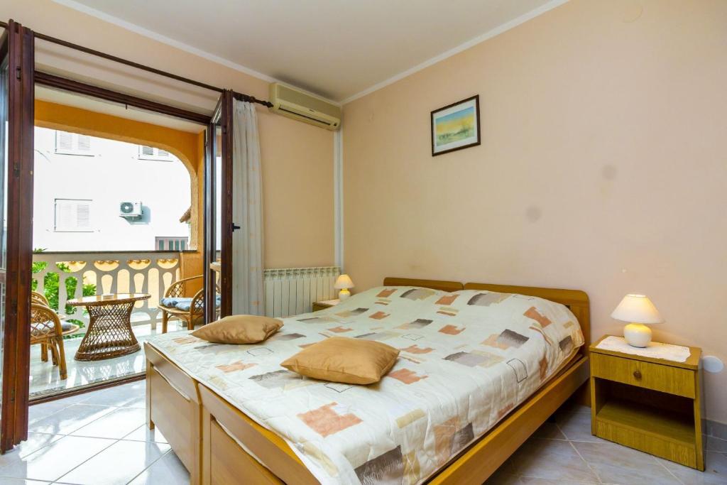Postel nebo postele na pokoji v ubytování Apartments Mir