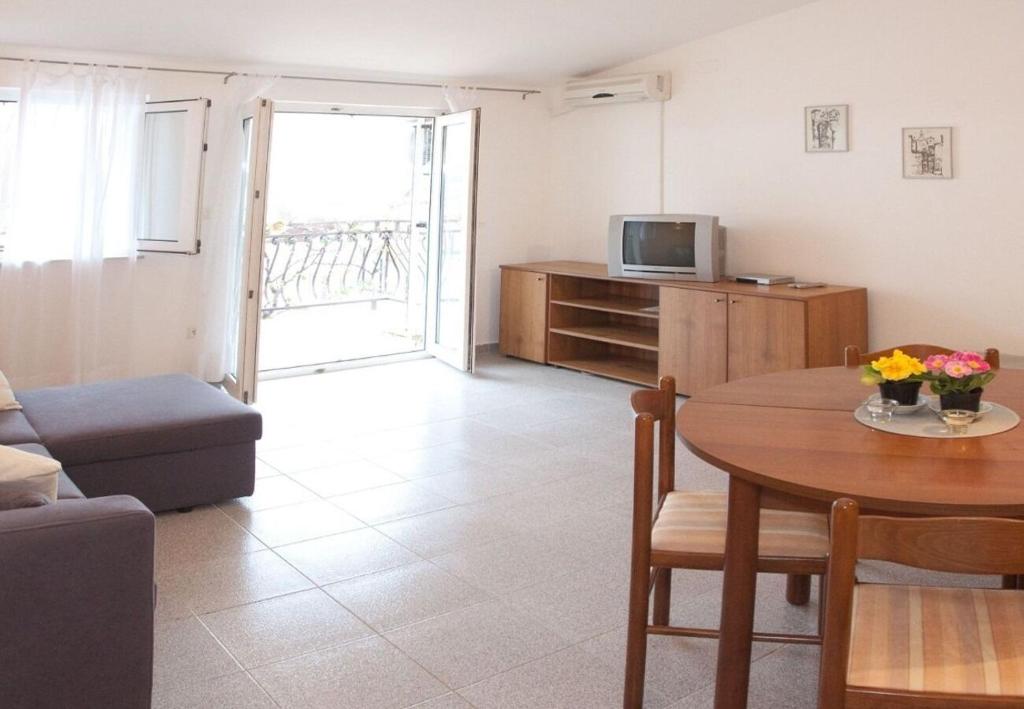 Televízia a/alebo spoločenská miestnosť v ubytovaní Apartments Filip