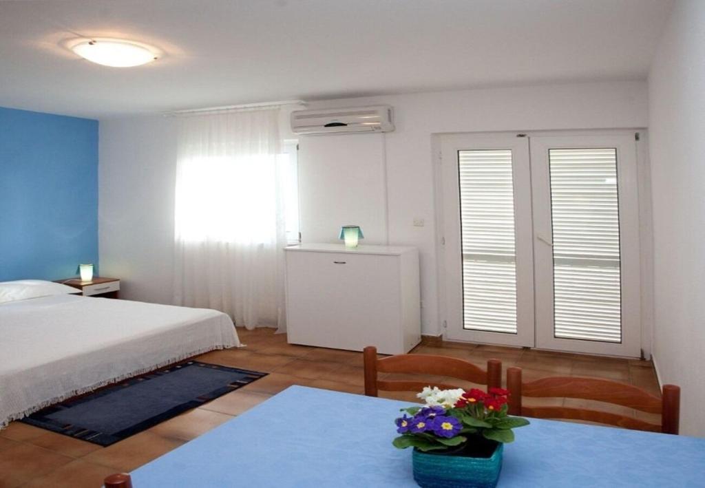 Posteľ alebo postele v izbe v ubytovaní Apartments Filip