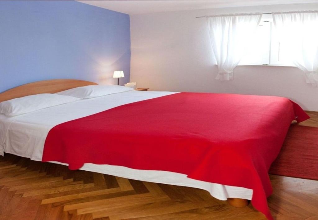 Posteľ alebo postele v izbe v ubytovaní Apartments Filip