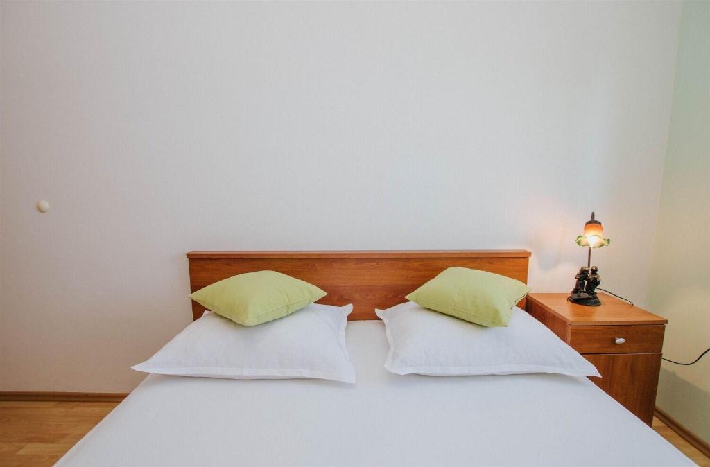 Postel nebo postele na pokoji v ubytování Apartments Dome