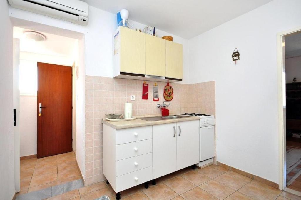 Kuchyň nebo kuchyňský kout v ubytování Apartments Dome