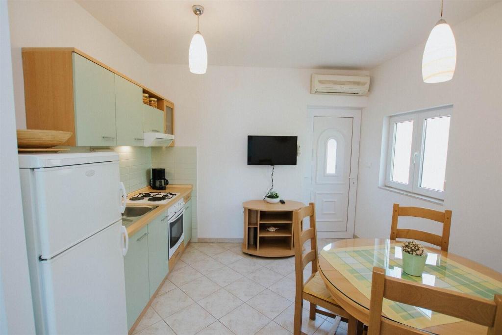 Kuchyň nebo kuchyňský kout v ubytování Apartments Dome