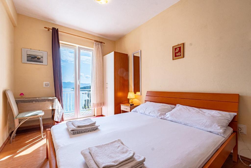 Postel nebo postele na pokoji v ubytování Apartment Mir