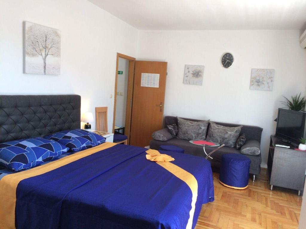 Posteľ alebo postele v izbe v ubytovaní Apartment Tomi
