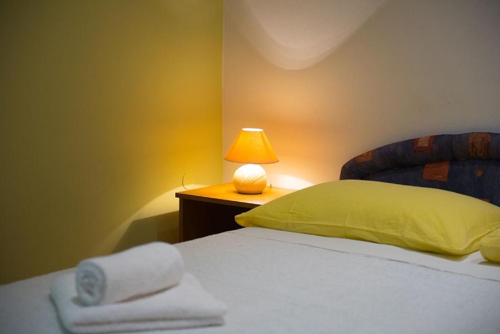 Posteľ alebo postele v izbe v ubytovaní Apartments and Rooms Robi